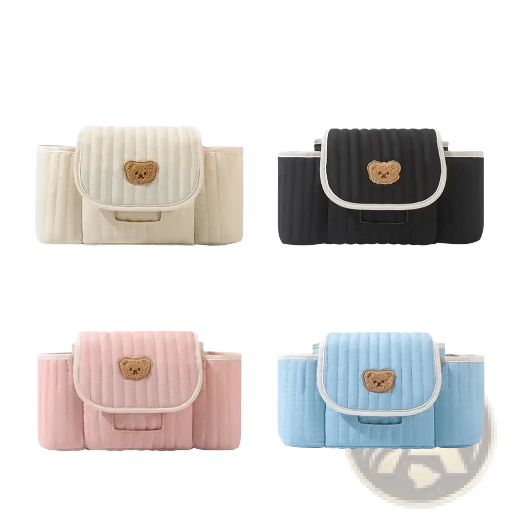 Quilted baby stroller organizer bag in cream black pink or sky blue with a tan embroidered teddy bear patch on the flap