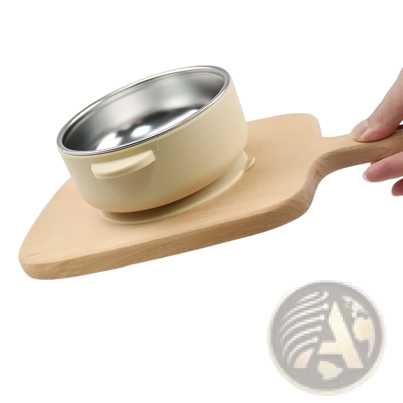 Cream-colored baby training bowl with stainless steel interior and handle resting on a wooden serving board