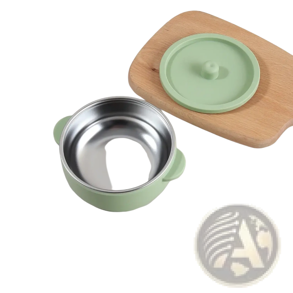 Light green baby training bowl with stainless steel interior, silicone lid, and small handles for easy grip and weaning use