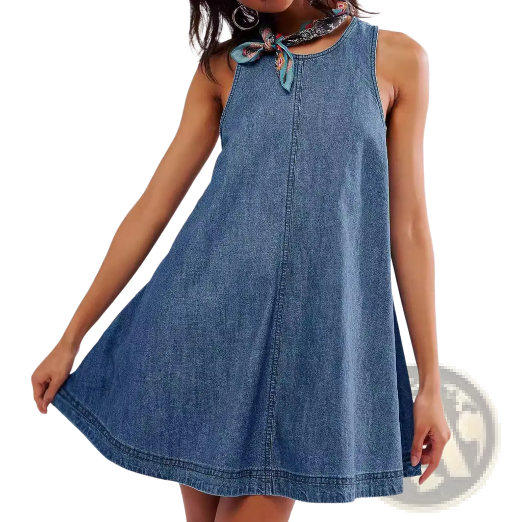 A sleeveless medium blue wash denim mini dress with a round neckline and patterned fabric tie bow accent