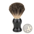 Black glossy ceramic badger hair shaving brush with dense tapered dark brown and light tan bristles for shaving use