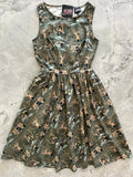 Olive green sleeveless cotton dress with whimsical badger and mouse vintage wizard print and fitted flared design