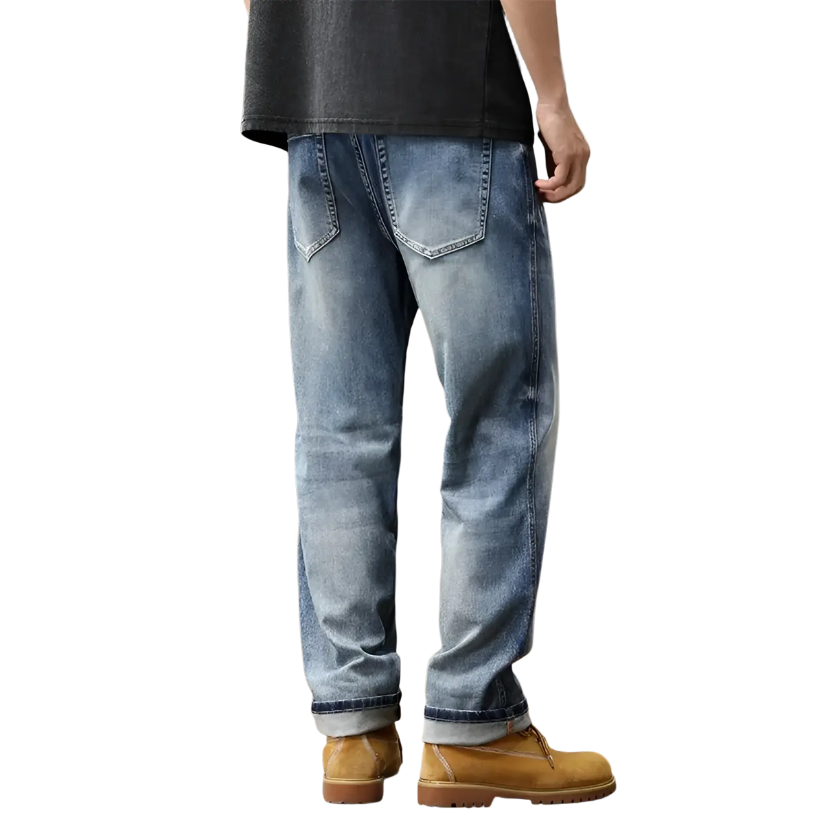 Baggy light blue denim jeans with a relaxed fit, wide leg, light-wash material, and rolled cuffs