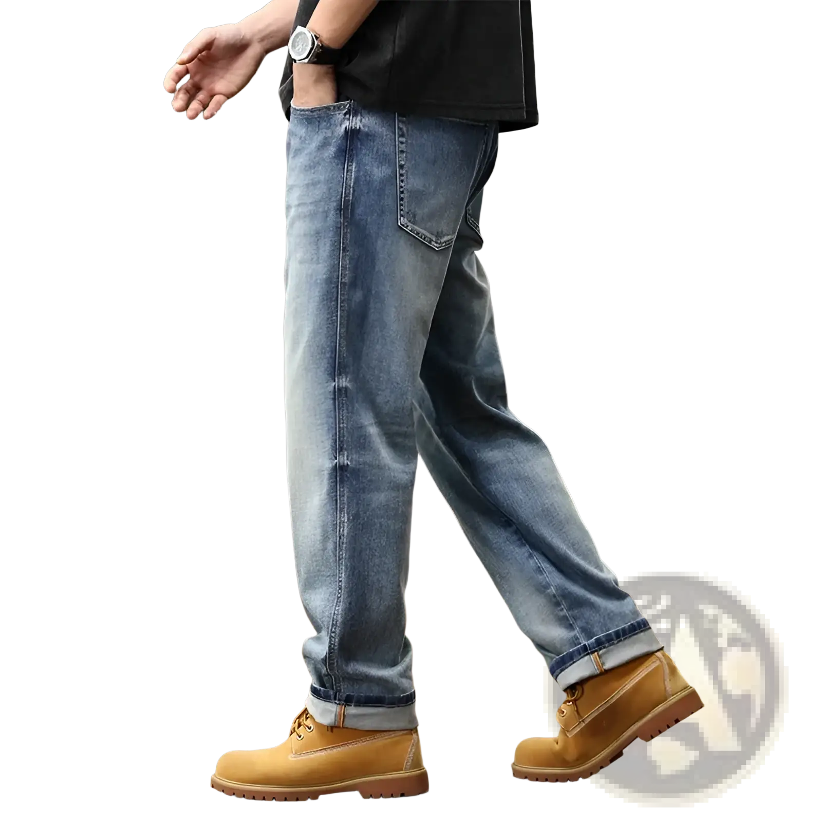 Baggy light blue denim jeans with a relaxed fit and rolled cuffs paired with tan work boots