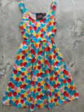 A vibrant sleeveless fit and flare dress with a multicolored watercolor balloon print on a white background
