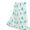 Bamboo cotton floral baby swaddle blanket in soft lightweight fabric with mint green leaves and blush pink flowers on white