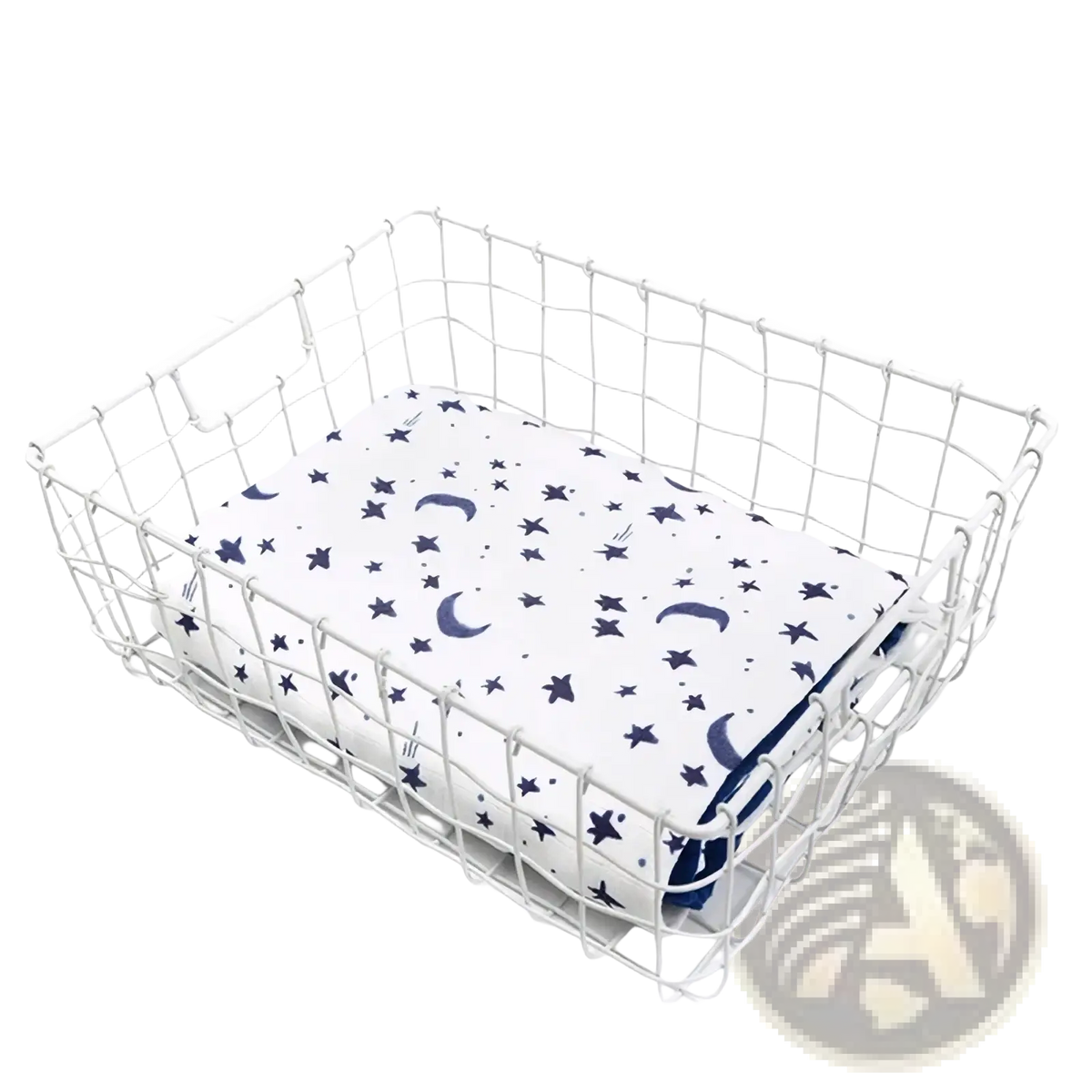 White wire mesh basket holding a bamboo cotton floral baby swaddle blanket with navy star and crescent moon patterns