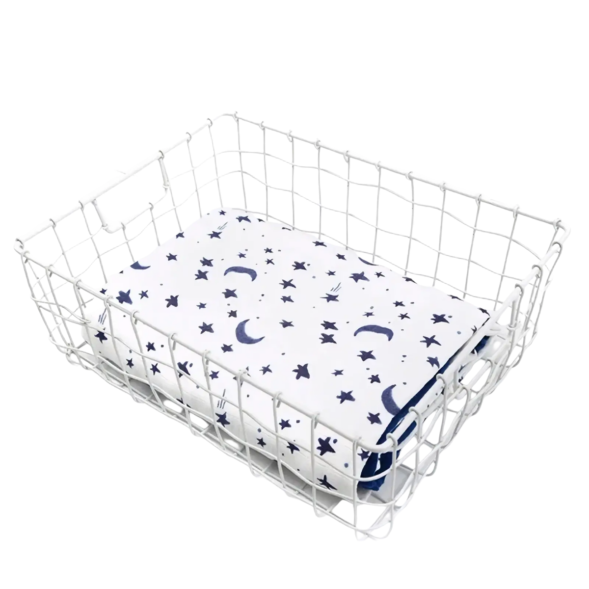 White wire mesh basket holding a bamboo cotton floral baby swaddle blanket with navy star and crescent moon patterns