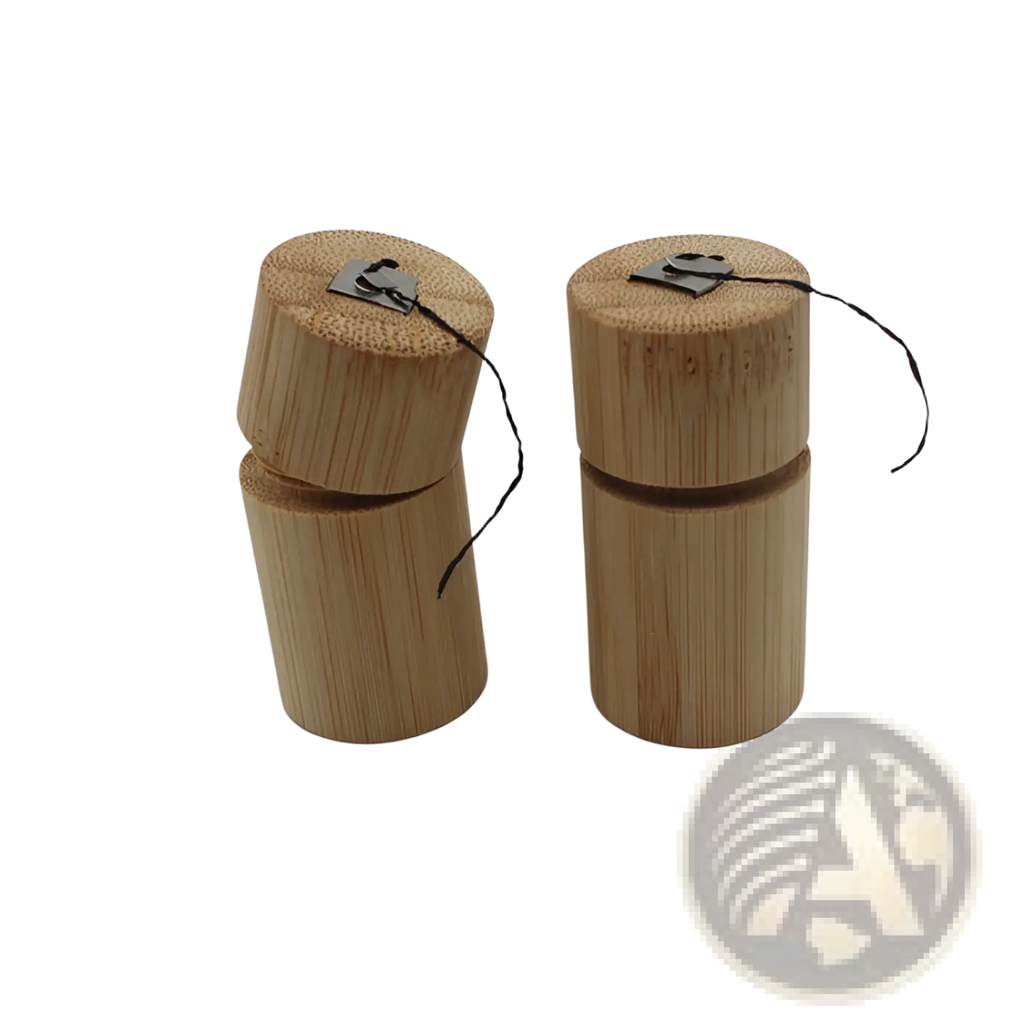 Two light brown bamboo floss tube portable biodegradable cases with black string and metal tags for dental use