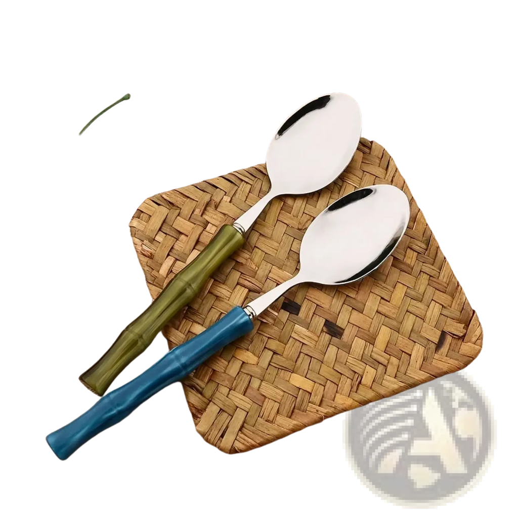 A pair of stainless steel spoons with shiny bowls and green and blue bamboo inspired handles from flatware set