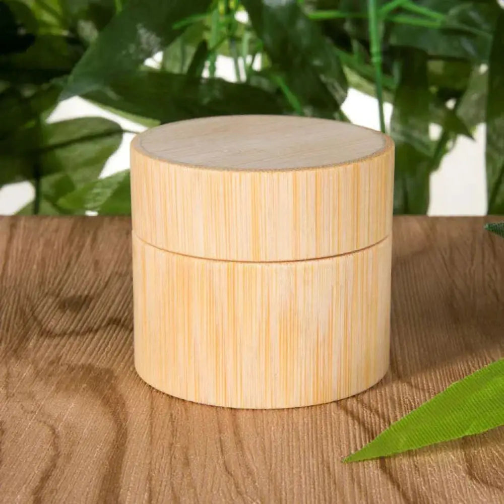 Light-colored bamboo cylindrical jar with matching lid handcrafted eco friendly bamboo cosmetic jar for storage