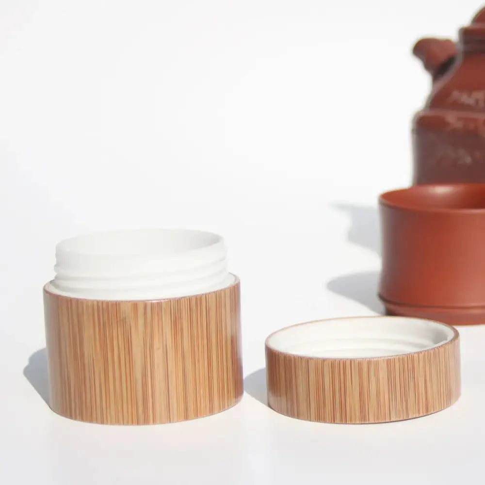 Handcrafted eco friendly bamboo cosmetic jar with bamboo texture, matching lid, white interior, and rim