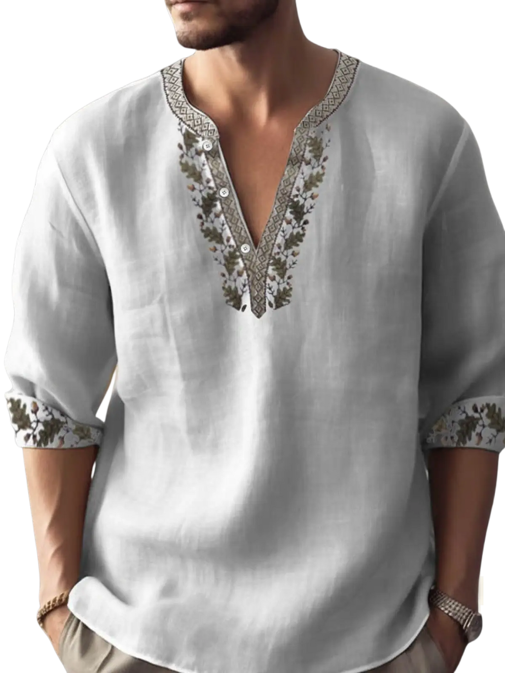 White bamboo linen long sleeve shirt with intricate green and beige embroidery along v-neckline and rolled cuffs