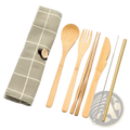 Light brown bamboo utensil set with matching checkered fabric case and metal straw brush for travel use