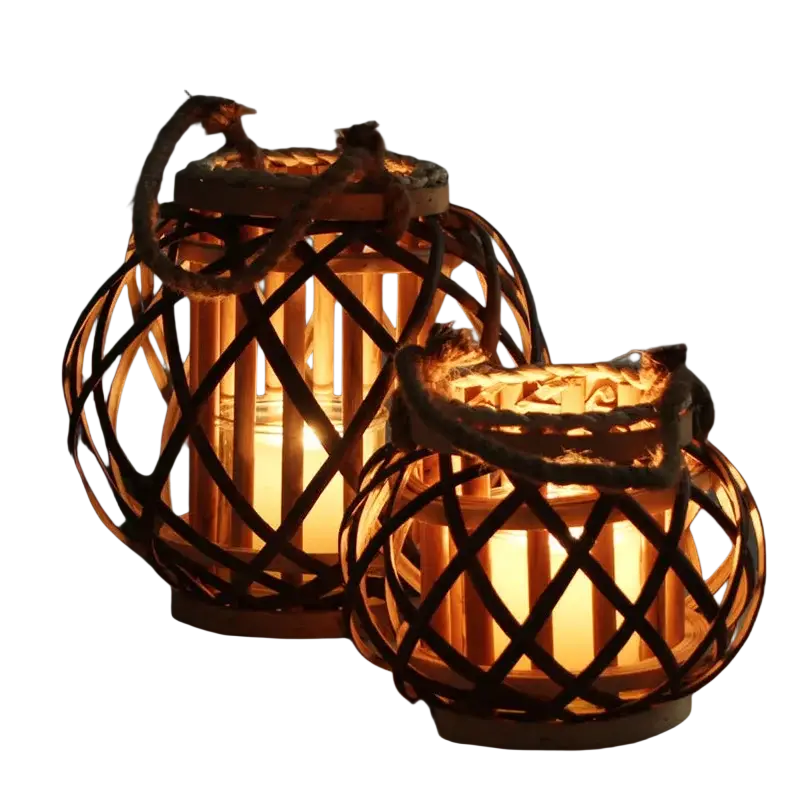 Two rustic bamboo woven candle holders with rope handles illuminated by warm candlelight for home decoration