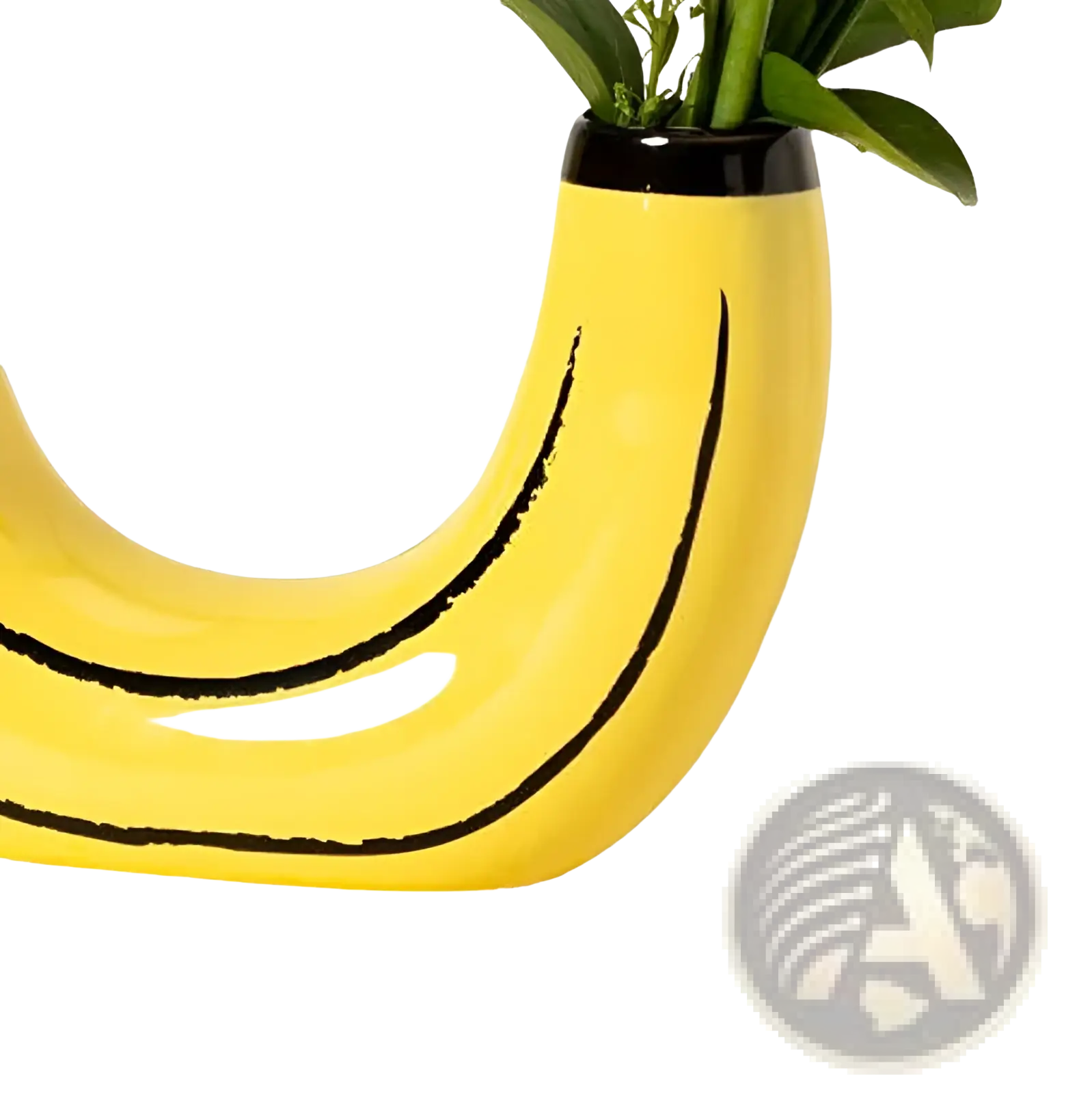 A bright yellow ceramic banana-shaped vase with black curved lines and glossy finish holding green foliage