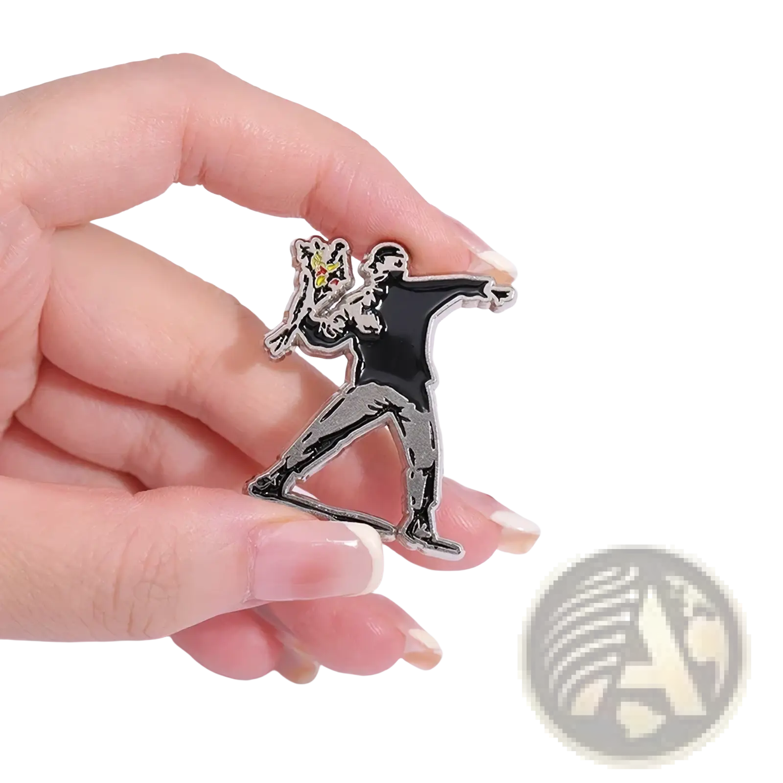 Black and silver enamel pin featuring a stylized figure holding a yellow spray can from Banksy street art badge