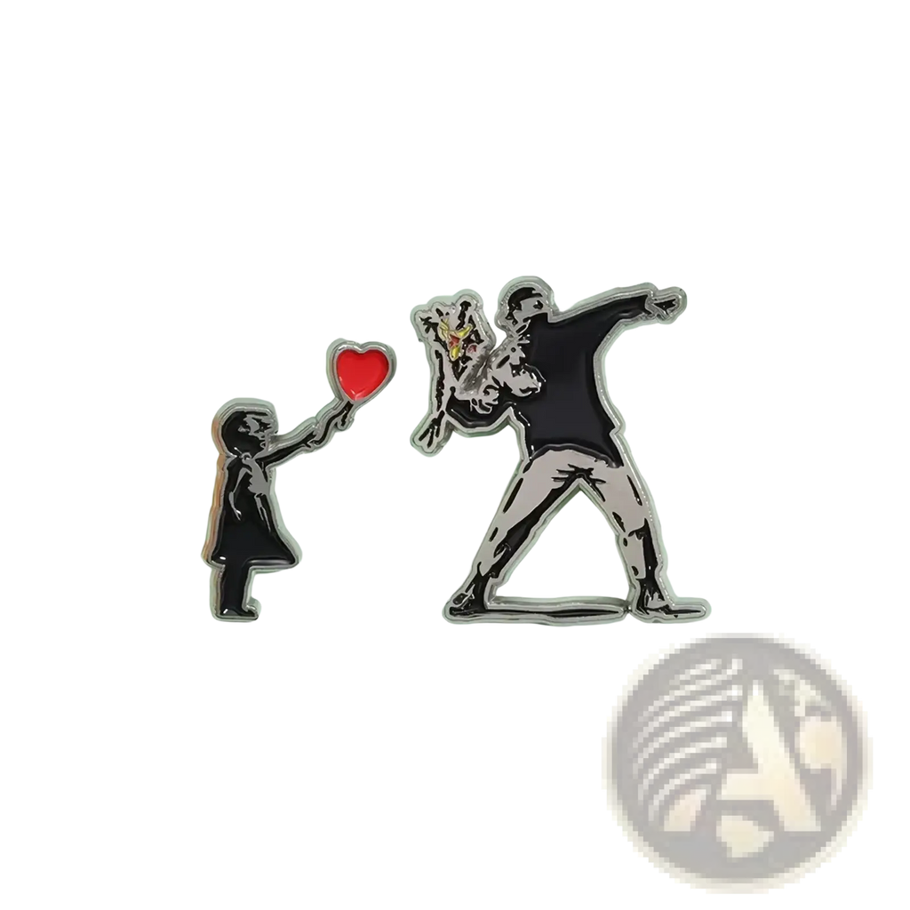 Two banksy enamel pin street art brooch badges featuring child with balloon and man dabbing with dog in black white silver