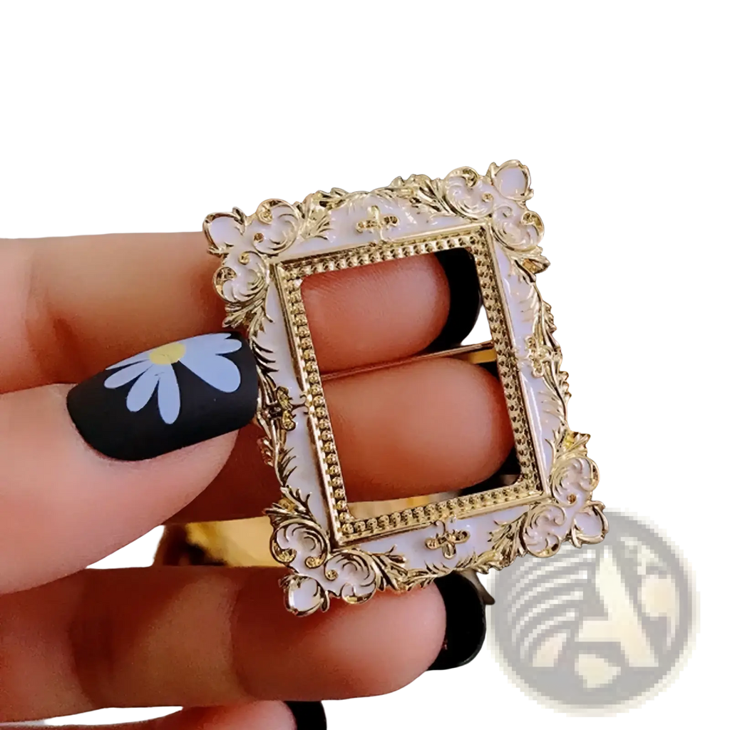 Baroque David art picture frame brooch in gold tone and white enamel with delicate ornate scrollwork detailing