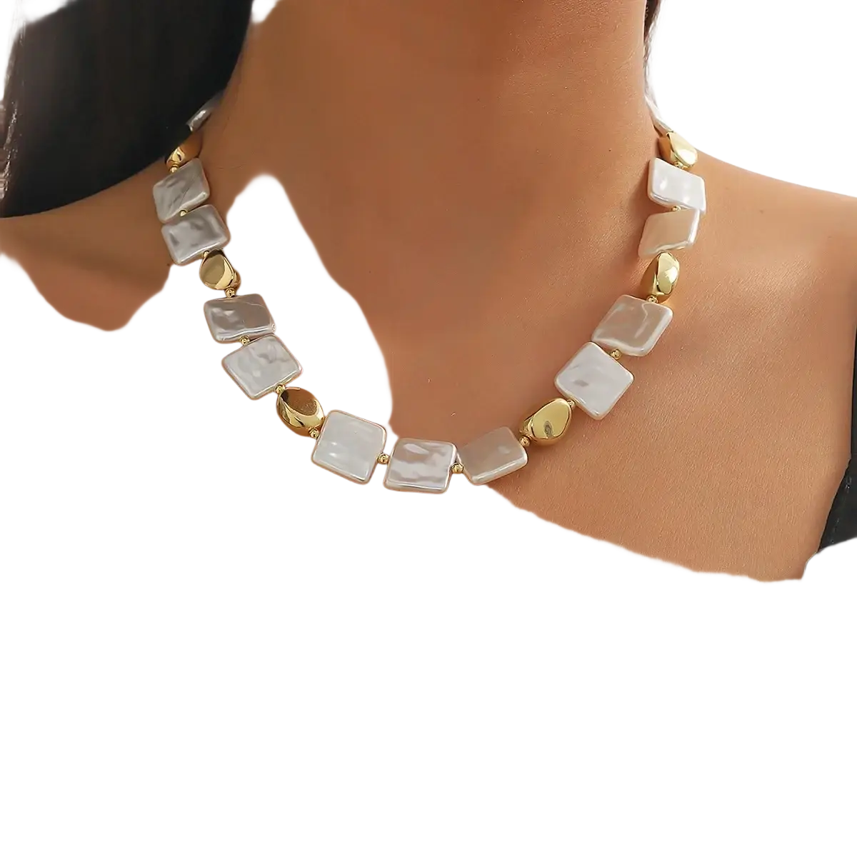 A baroque pearl gold chain necklace with alternating square white pearls and gold-toned metallic beads