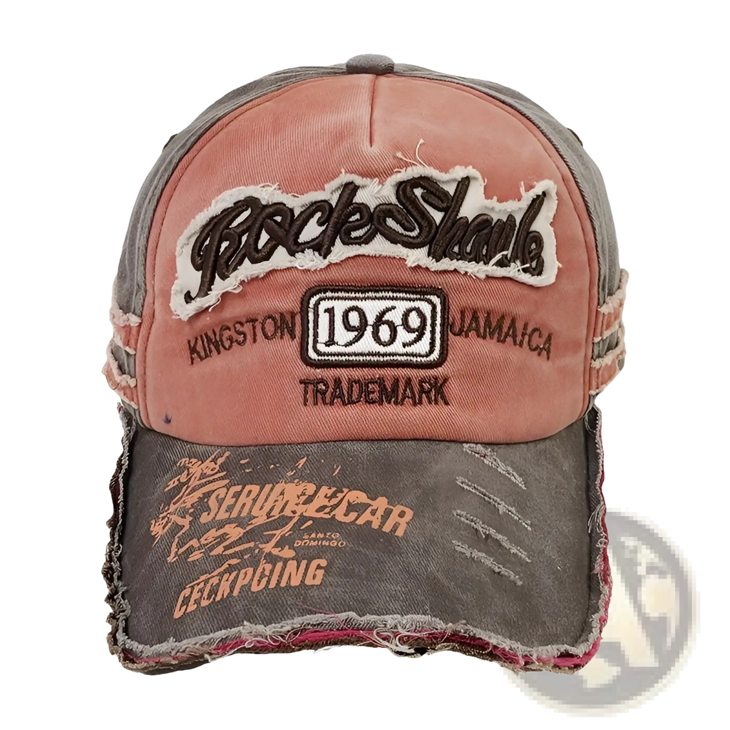 Baseball cap distressed vintage jamaica 1969 in pink and gray with frayed edges and faded orange rockshark patch