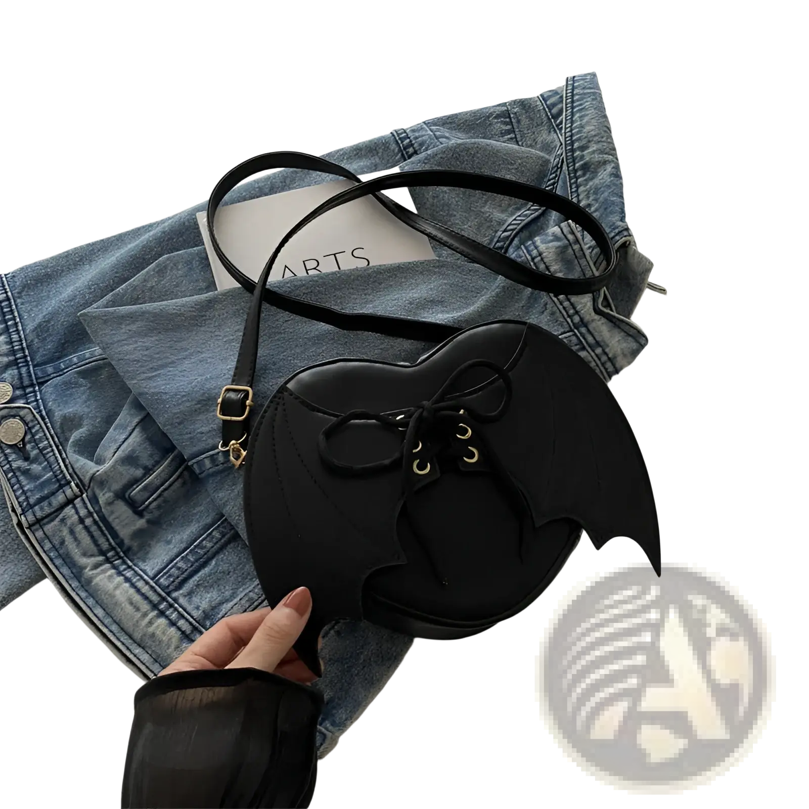 Black bat wing heart crossbody bag with lace up detail and gold tone hardware for stylish everyday use