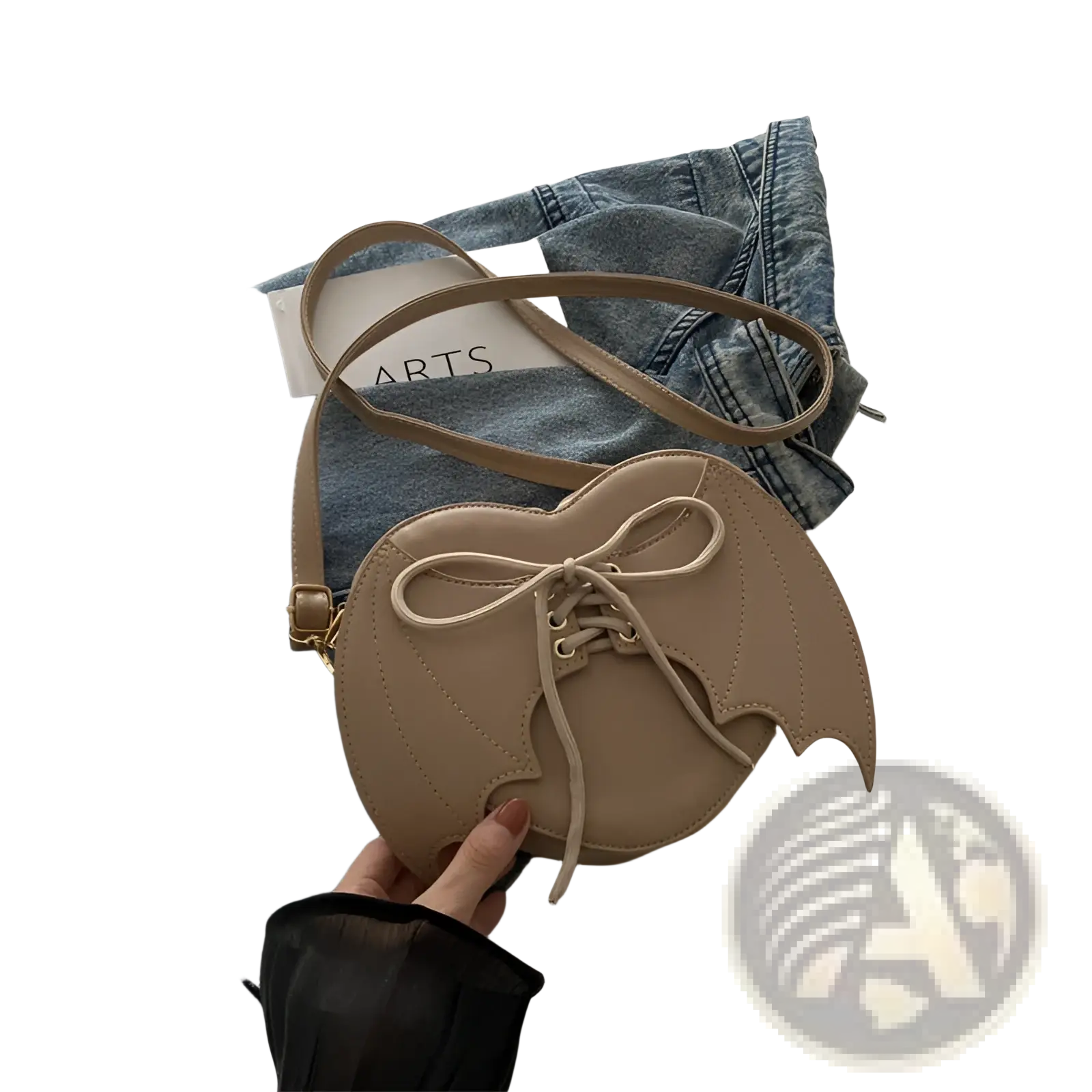 Beige bat wing heart crossbody bag with lace up front detail and matching strap in soft material