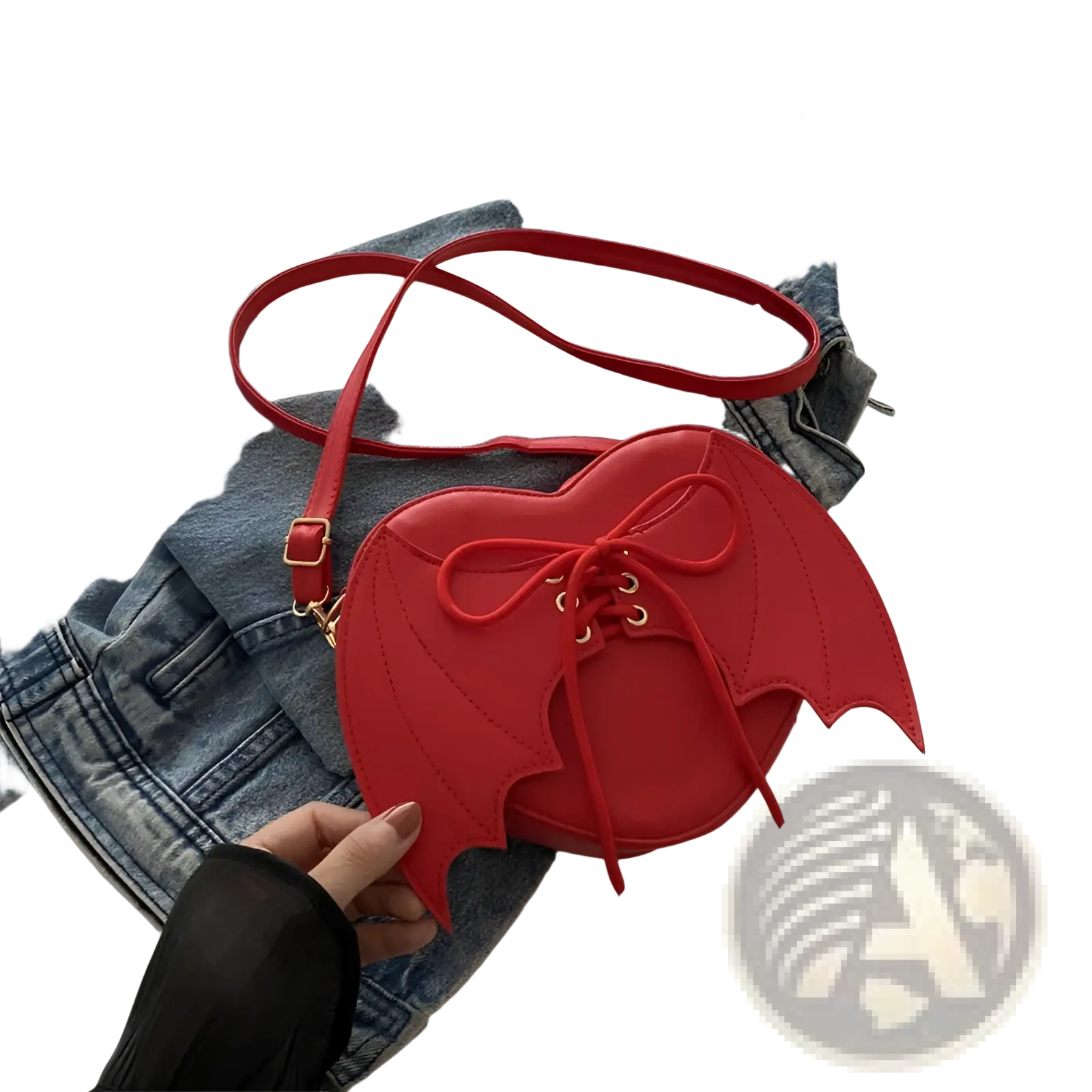 Red heart-shaped leather crossbody bag with bat wing details and lace-up front for stylish everyday use