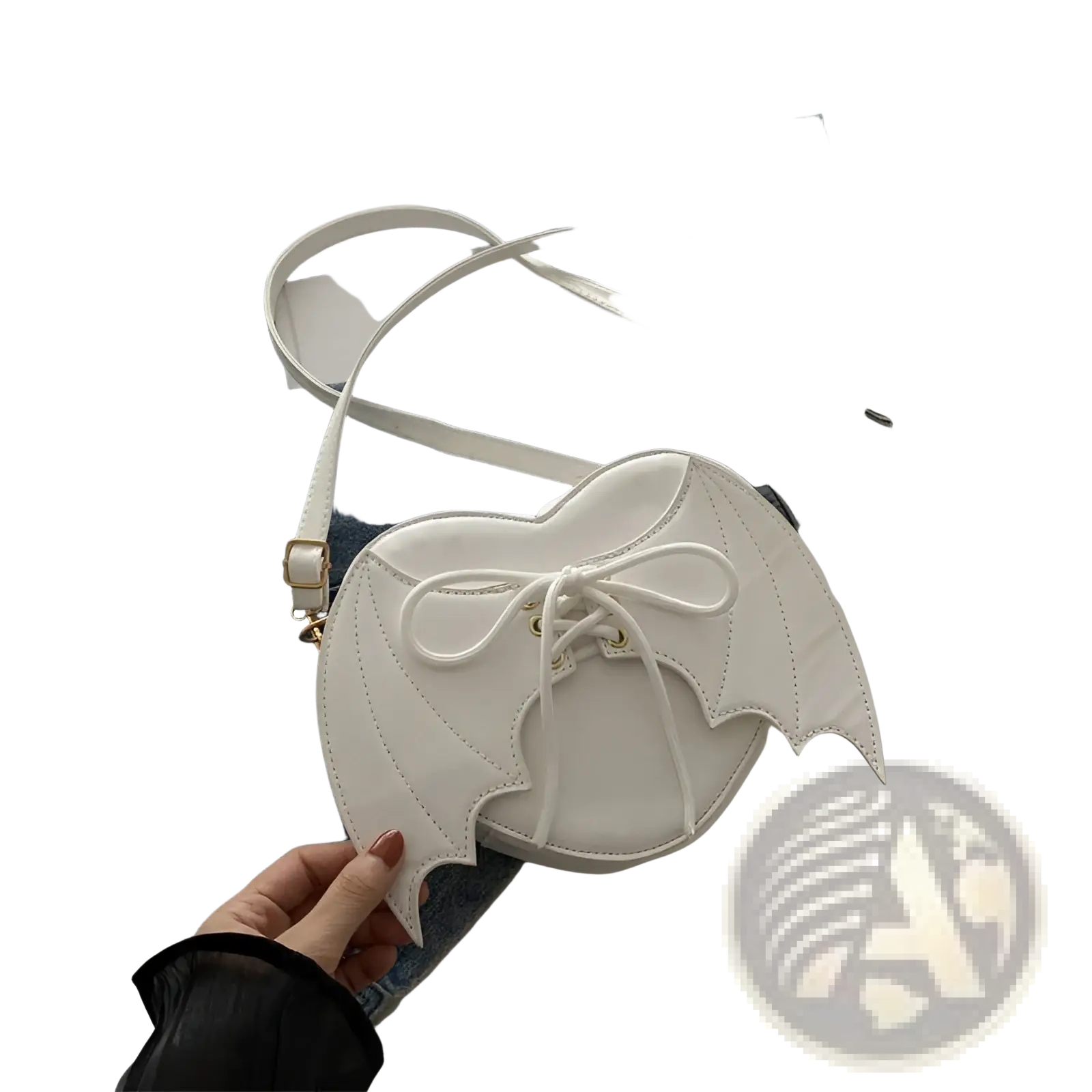 White bat wing heart crossbody bag with lace-up front and stitched wing details in faux leather material