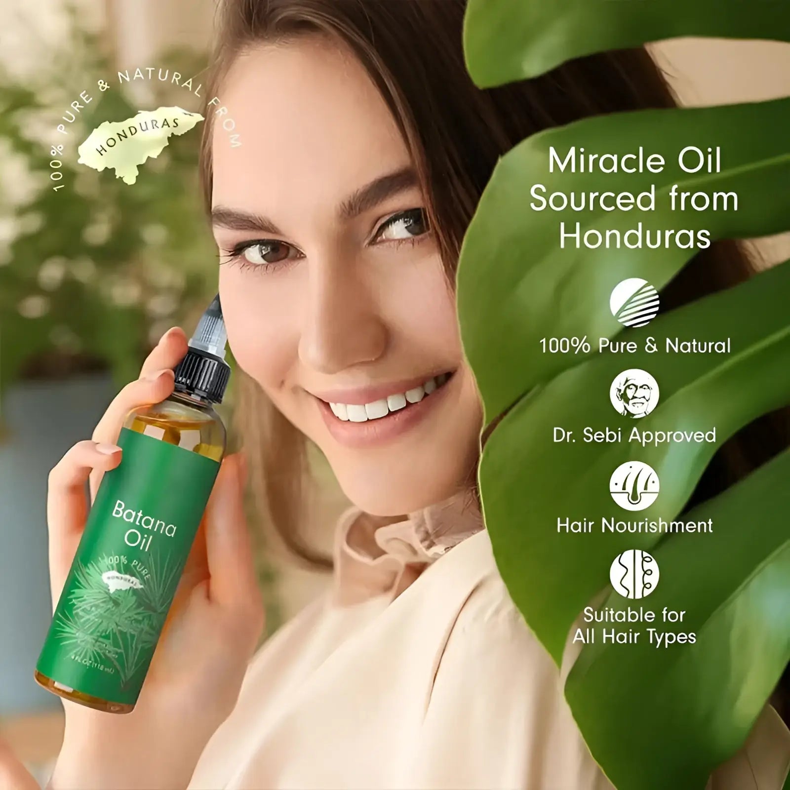 Green glass bottle of batana oil hair growth and nourishing essential oil with black cap and leaf design label