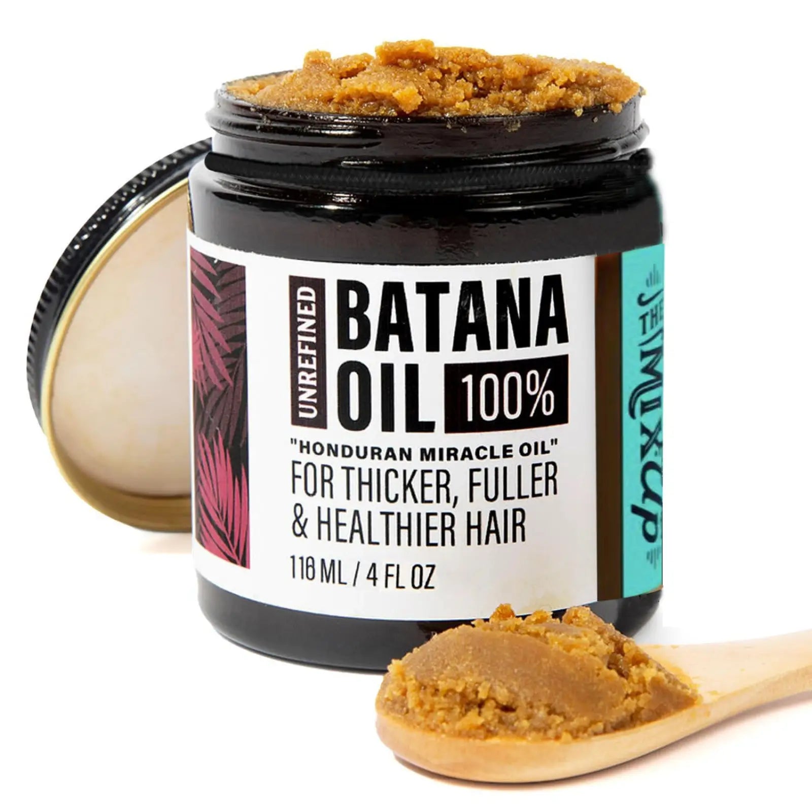 A jar of unrefined batana oil hair mask in a black glass container for thicker fuller hair 118g with tropical leaf label