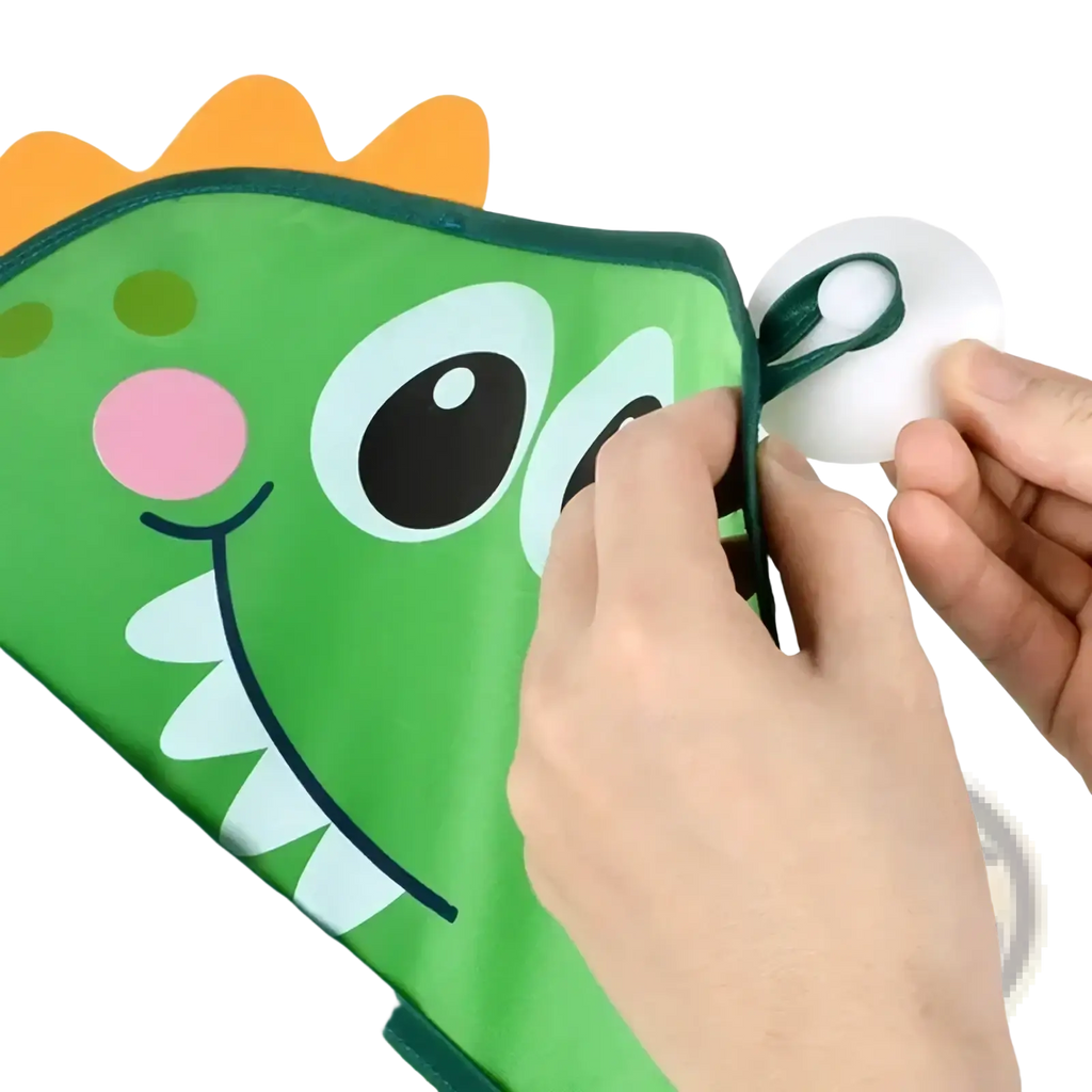 Green dinosaur-shaped bath toy storage mesh bag organizer with orange spiky mane pink nose and white teeth