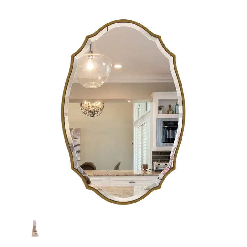 An elegant gold ornate oval bathroom mirror with a decorative frame above a wooden console table in mirror style