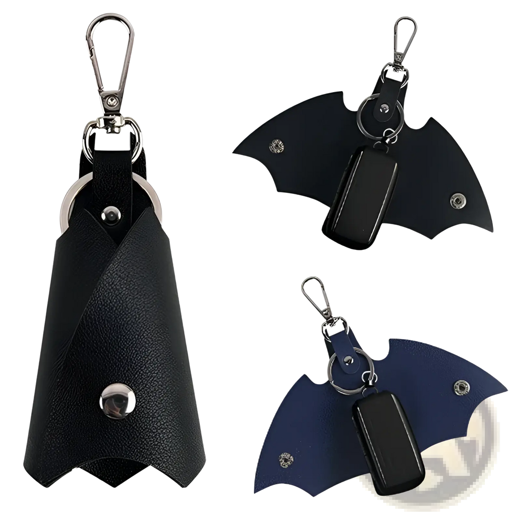 Black leather batman-shaped keychain with silver hardware and matching black leather card holder for everyday use