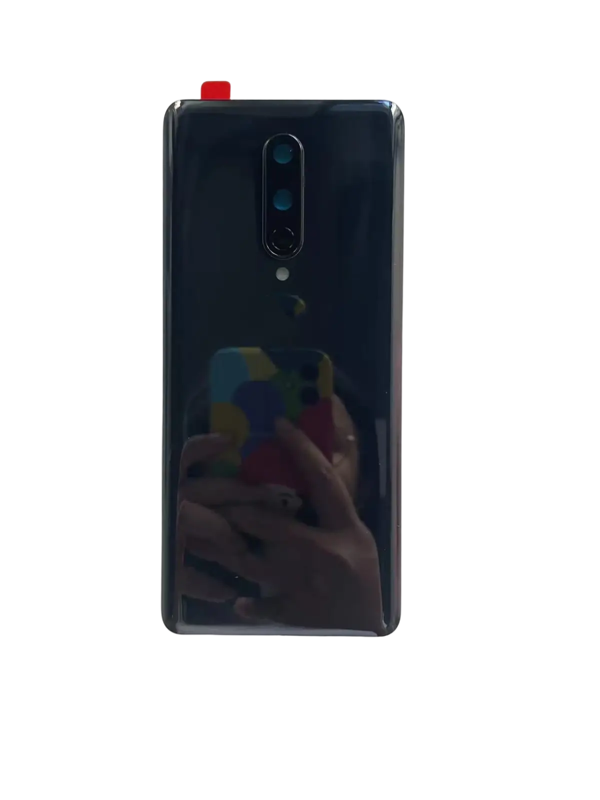 Black glossy back side of oneplus 8 pro with vertical triple-camera and brand logo battery cover hard gorilla glass