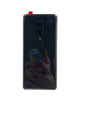 Back side of a sleek dark blue oneplus 8 smartphone with a cover hard battery cover made of hard gorilla glass