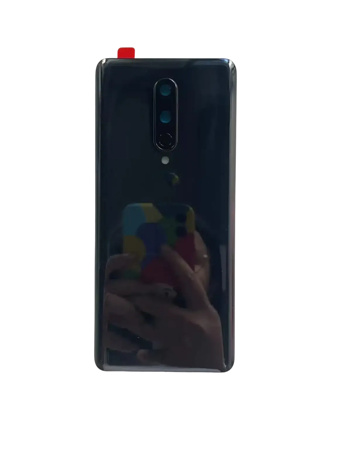 Back side of a sleek dark blue oneplus 8 smartphone with a cover hard battery cover made of hard gorilla glass