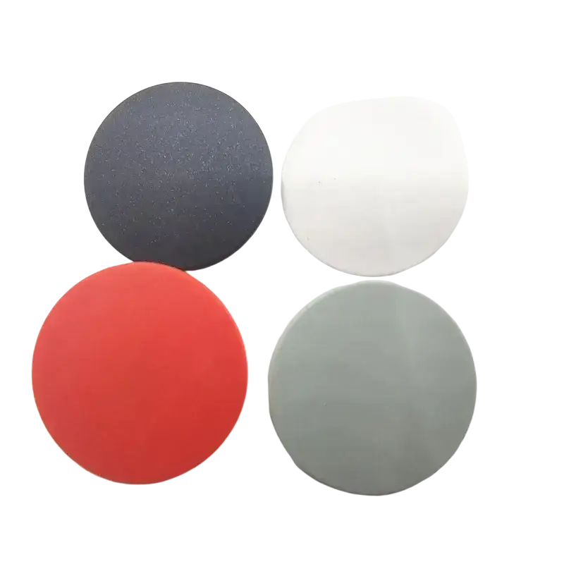 Set of four circular polishing pads in black white red and gray with adhesive backing for nothing cmf phone battery cover