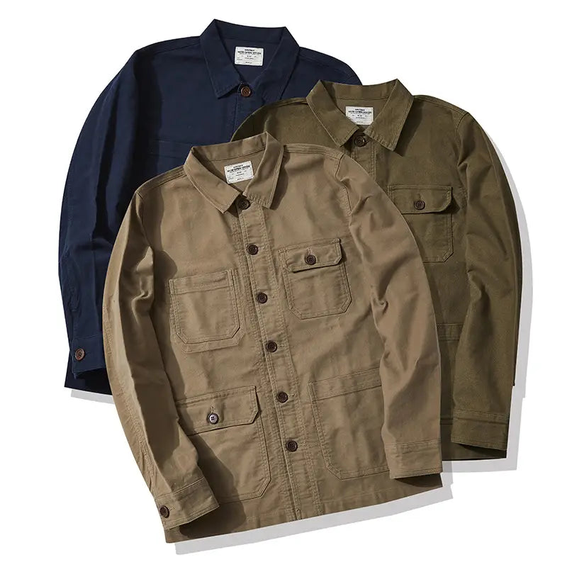 Mens french workwear jacket in tan cotton with buttoned chest and lower utility pockets and a classic collar design.