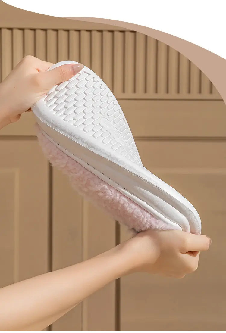 pink fuzzy smiling cloud and rainbow plush cotton slipper with white rubber sole featuring a textured grid-like pattern