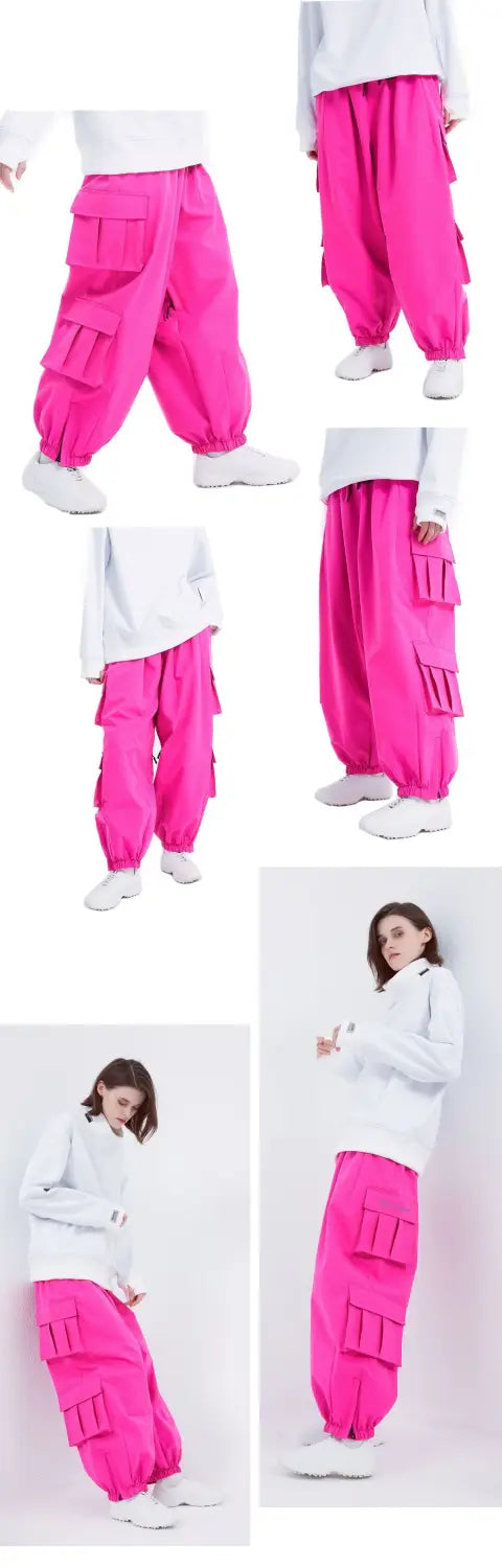 Bright pink winter outdoor loose ski pants made of durable material featuring multiple flap pockets and elastic cuffs for enhanced functionality and comfort.