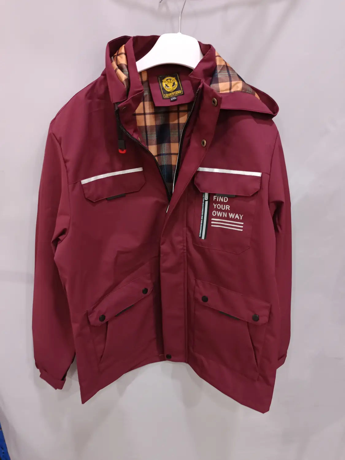 Men winter hooded parka coat in maroon with plaid lining and find your own way text on the chest pocket.