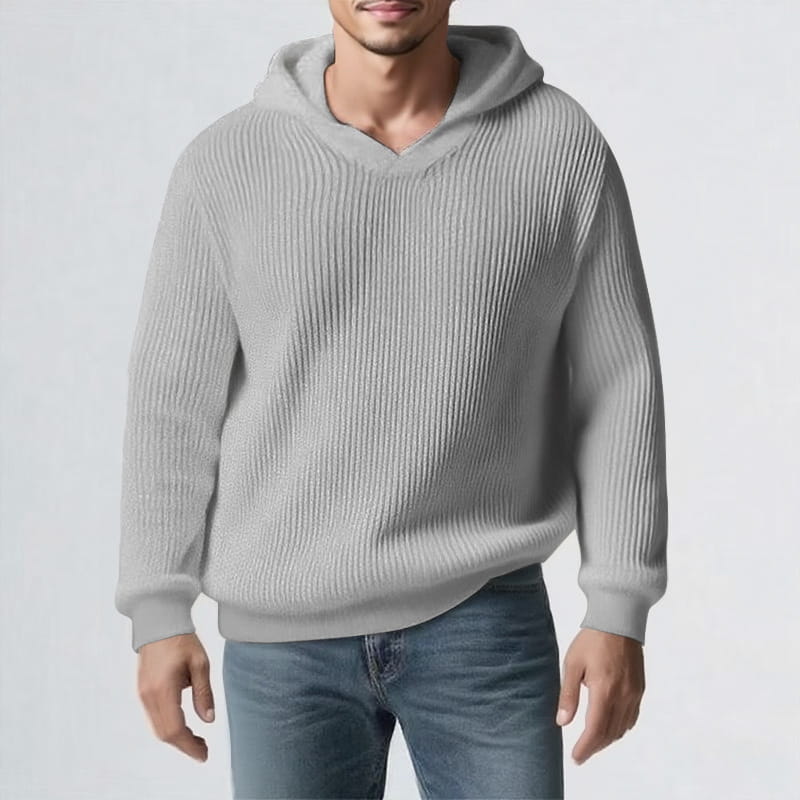 Una sudadera tipo jersey con capucha para hombre de invierno engrosada, de color gris claro, fabricada en tejido de punto acanalado, con capucha acogedora y mangas largas.