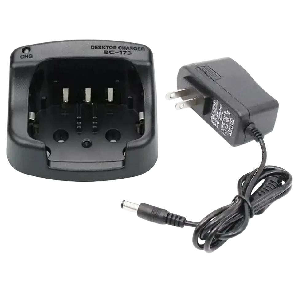 Black plastic bc-173 desktop charger with matching power adapter for icom radios shown from the back side