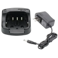 Black plastic bc-173 desktop charger with matching power adapter for icom radios shown from the back side