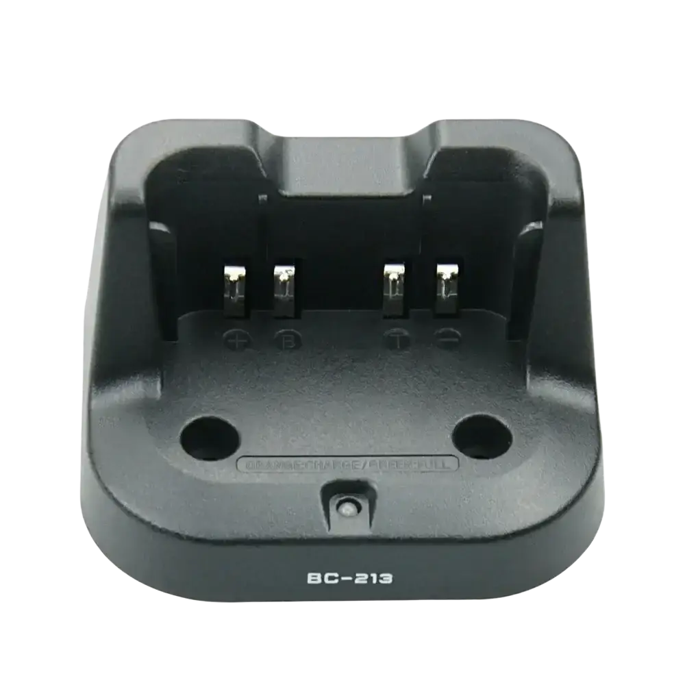 Black plastic bc-213 desktop charger for icom radios with four metallic contacts and two circular holes visible