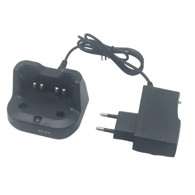 Bc-213 desktop charger in black plastic with three metallic contacts and black two-prong european power adapter for icom radios