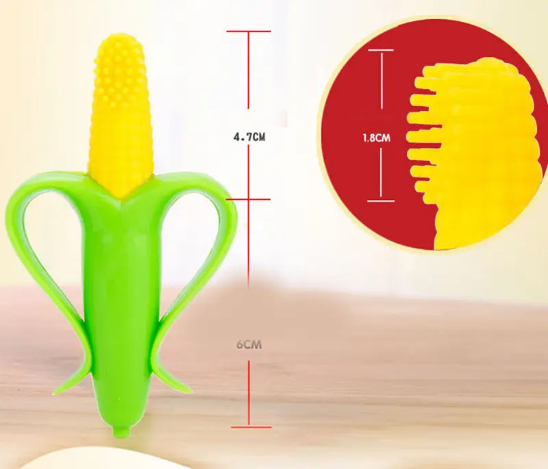 Green and yellow silicone baby teether shaped like a corn cob with textured ridges for soothing gums in the banana teether silicone baby toothbrush toy design.