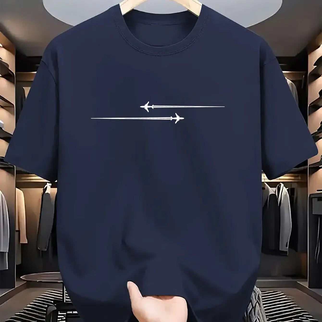 Navy blue crew neck t shirt made of cotton blend featuring a minimalist white airplane graphic design suitable for sport.