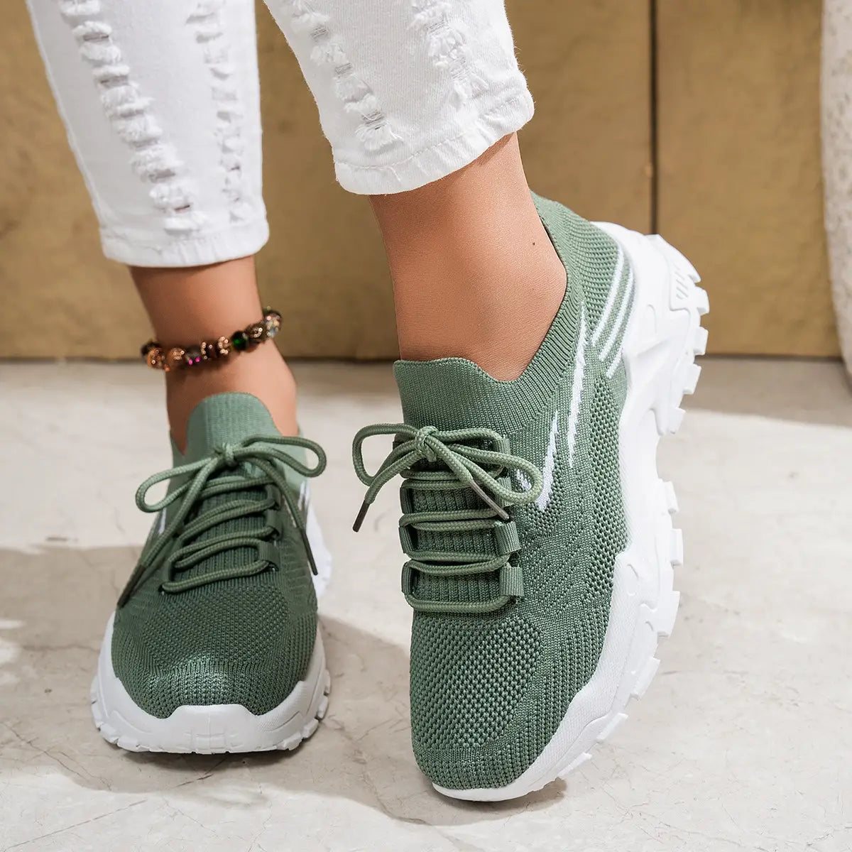 women’s lightweight breathable mesh lace up sports shoes in gray knit with chunky white sole and pink accents